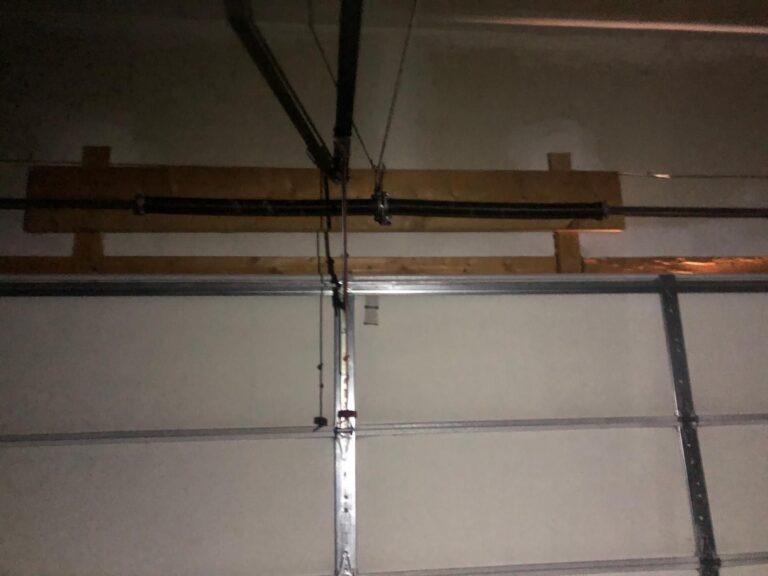 Broken garage door torsion spring replaced by TBC Garage Doors in Toronto