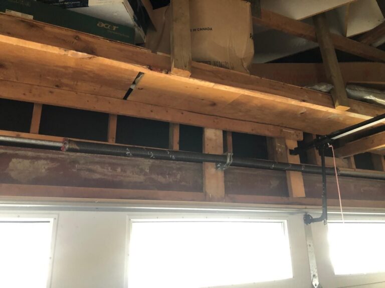 Broken garage door torsion spring replaced by TBC Garage Doors in Toronto
