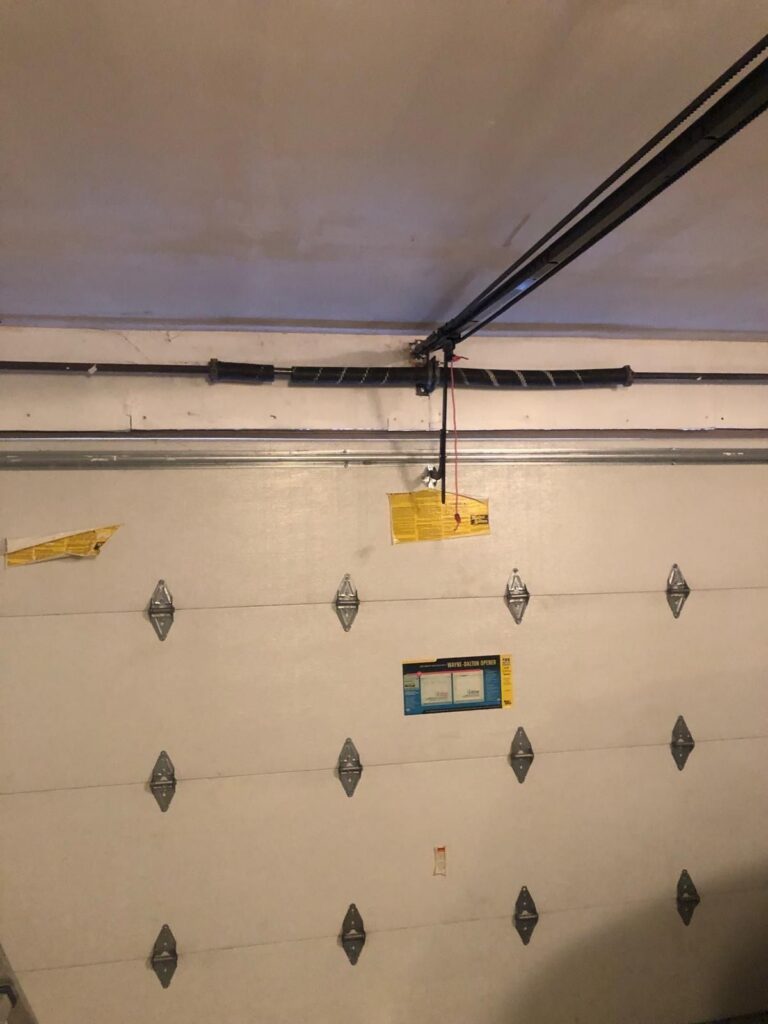 Broken garage door torsion spring replaced by TBC Garage Doors in Toronto
