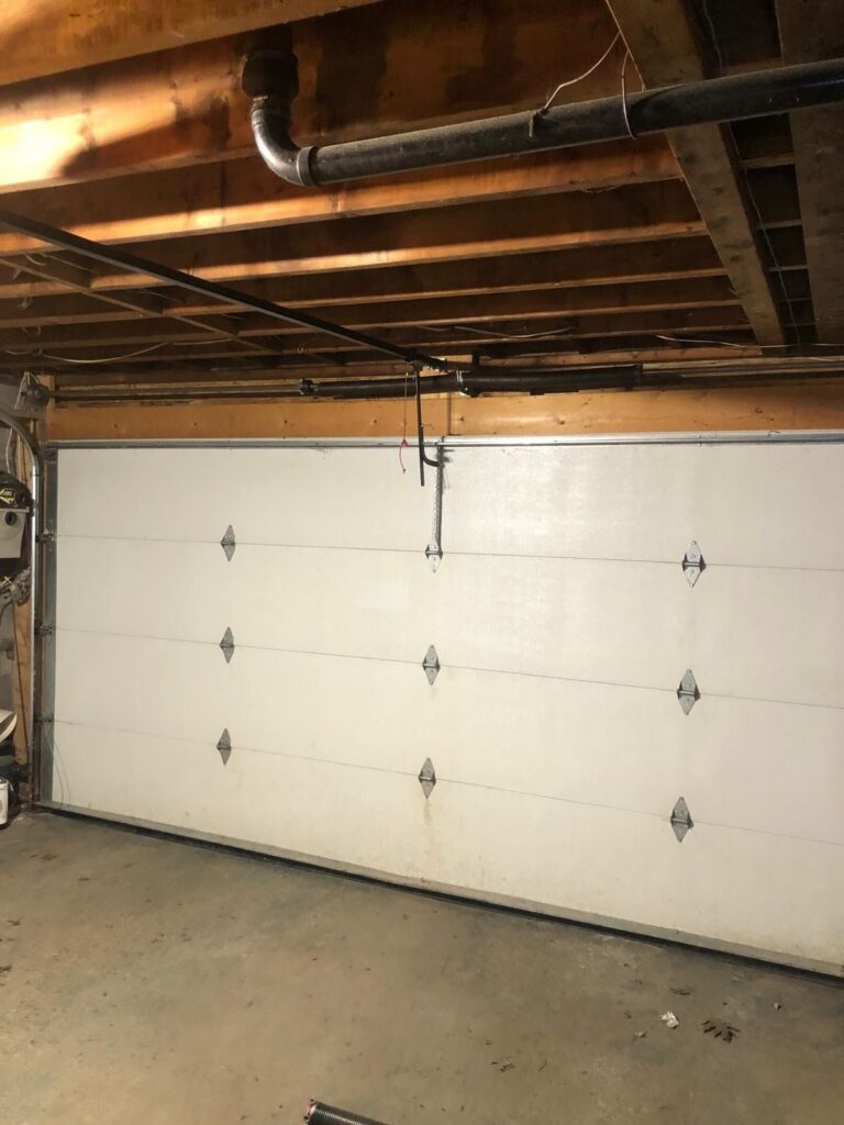 Broken garage door torsion spring replaced by TBC Garage Doors in Toronto