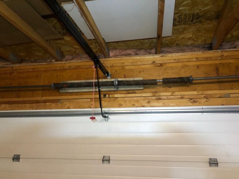 Broken garage door torsion spring replaced by TBC Garage Doors in Toronto