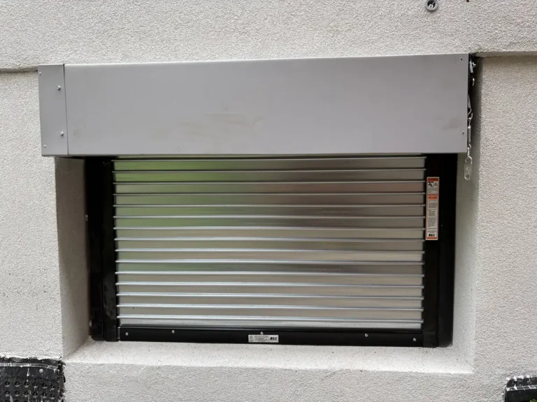 Close-up of a fire-rated window shutter installed by TBC Garage Doors in Toronto