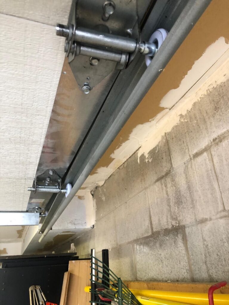 Garage door rollers, hinges and tracks serviced by TBC Garage Doors in Toronto