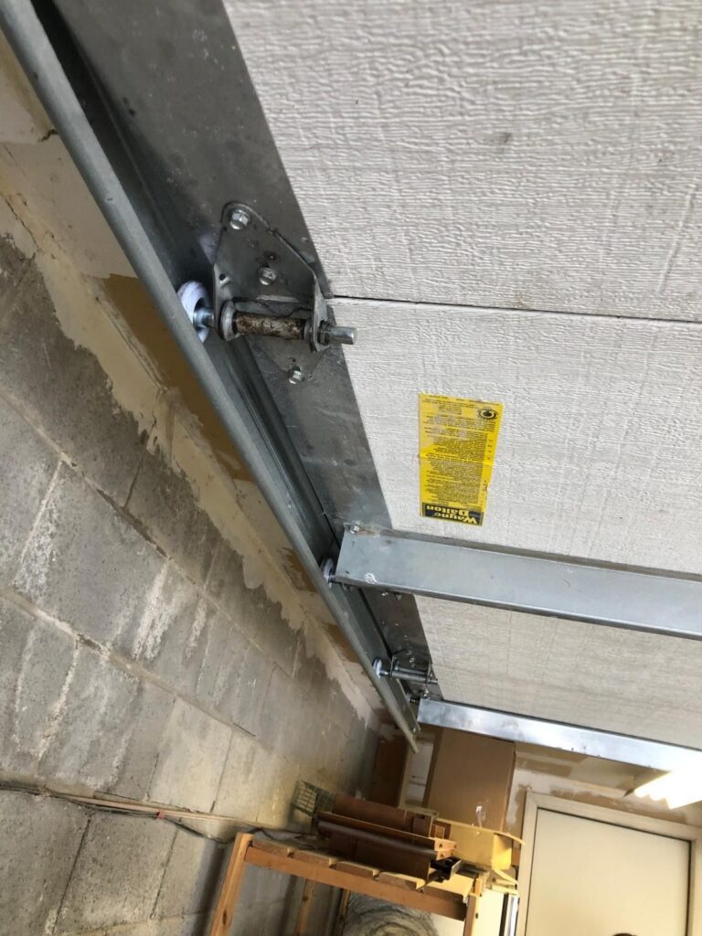 Garage door rollers, hinges and tracks serviced by TBC Garage Doors in Toronto